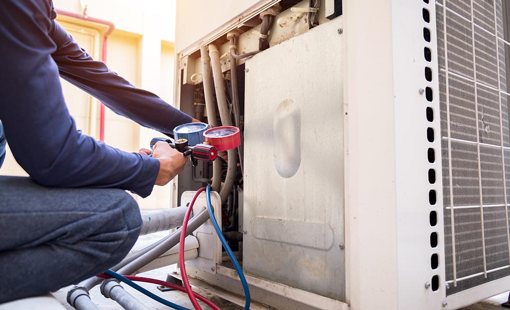 HVAC technician servicing equipment
